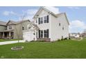 A beautiful suburban home shows off a large lawn and attached two car garage at 1142 Cobra Dr, Franklin, IN 46131