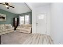 Cozy living room features neutral colors, comfortable seating, and carpeted floors at 1142 Cobra Dr, Franklin, IN 46131