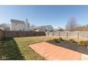 Fenced backyard featuring a grass lawn and patio area at 15405 Fawn Meadow Dr, Noblesville, IN 46060