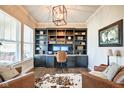 Home office with custom built-ins, hardwood floors, large windows and lots of natural light at 1591 W 151St St, Westfield, IN 46074