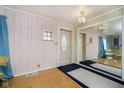 Inviting entryway with a mirrored wall, and light fixture at 2349 S Randolph St, Indianapolis, IN 46203