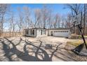 Spacious driveway leading to a charming home with attached garage and basketball hoop at 2408 E Stafford Pl, Martinsville, IN 46151