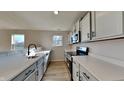 Bright kitchen boasts stainless steel appliances, quartz countertops, and ample cabinet space at 2617 N Temple Ave, Indianapolis, IN 46218