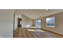 Spacious living room features vaulted ceilings, new floors, and natural light at 2617 N Temple Ave, Indianapolis, IN 46218
