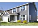 View of the home showcasing its well-maintained lawn and inviting front entrance at 298 Rocky Rd, Greenfield, IN 46140