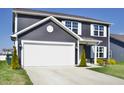 Classic home with a two-car garage, tidy landscaping, and a well-kept lawn at 298 Rocky Rd, Greenfield, IN 46140
