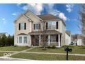 Attractive two-story home with well-maintained lawn and classic architectural details at 3432 Shepperton Blvd, Indianapolis, IN 46228