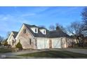 Side view of the home showing a spacious three-car garage and a basketball hoop at 37 Trotters Run, Brownsburg, IN 46112