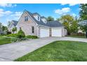 Spacious two-car garage with a concrete driveway and a basketball hoop for outdoor fun at 37 Trotters Run, Brownsburg, IN 46112