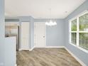 Open dining area adjacent to the kitchen with stainless steel appliances at 451 Filmore Dr, Westfield, IN 46074
