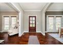 Elegant foyer boasting hardwood floors, a stylish rug, and a view into bright, inviting living spaces at 5032 N Illinois St, Indianapolis, IN 46208
