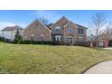 Inviting two-story brick home with a well-kept lawn and charming curb appeal at 5517 Westbourne Ct, Greenwood, IN 46143