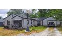 A well-maintained home with a manicured yard and attached one car garage at 618 S Tibbs Ave, Indianapolis, IN 46241
