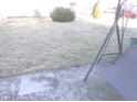 Backyard lawn, landscaping, and patio seating provide outdoor living at 6651 Sonesta Dr, Indianapolis, IN 46217