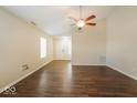 Bright living room with hardwood floors, a ceiling fan, and neutral walls at 7726 Belmac Ln, Camby, IN 46113
