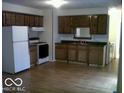 Kitchen features wood cabinets, and hard wood flooring at 8445 Montery Rd, Indianapolis, IN 46226