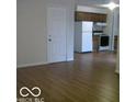 Living room with hardwood floors and a view into the kitchen at 8445 Montery Rd, Indianapolis, IN 46226