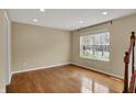 Bright room with hardwood floors, recessed lighting, and a view of the outdoors at 918 Rosalind Pl, Carmel, IN 46032