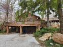 Spacious home with a large deck, drive-under garages, and charming curb appeal at 10960 Marlin Rd, Indianapolis, IN 46239