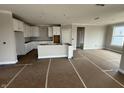 Bright, unfinished kitchen with white cabinets, a kitchen island, and new appliances at 14859 Amber Light Dr, Westfield, IN 46074