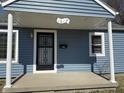 Close up of the covered front porch with support columns and visible house number at 1618 W 17Th St, Anderson, IN 46016