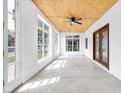Bright sunroom with large windows, a ceiling fan, and wood ceiling at 2031 Central Ave, Indianapolis, IN 46202