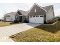 Brick home with a well-maintained lawn and driveway, offering a welcoming view at 3865 Kensington Dr, Danville, IN 46122