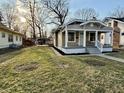 Charming exterior view of home featuring a manicured lawn and spacious front yard at 4504 Winthrop Ave, Indianapolis, IN 46205