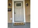 Front door detail with decorative accents and a 'Home Sweet Home' welcome mat at 4504 Winthrop Ave, Indianapolis, IN 46205