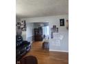Inviting living room with hardwood floors leading to dining area at 4930 Candy Spots Dr, Indianapolis, IN 46237