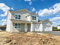 Charming two-story home with a two-car garage and a classic design enhanced by light, neutral colors at 5908 Agogo Way, Greenwood, IN 46143