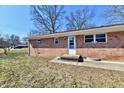 The house features a brick exterior with a patio perfect for outdoor entertaining at 7953 Forest Park Dr, Indianapolis, IN 46217