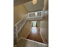 Inviting home entryway with stairs leading to second floor and hardwood floors into living area at 9459 Wimbledon Ct, Indianapolis, IN 46250