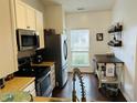 Bright kitchen showcasing modern appliances and a window with natural light at 950 Kempson Ct, Westfield, IN 46074
