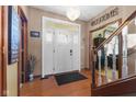 Inviting foyer with hardwood floors, a stylish chandelier, and a staircase leading to the upper level at 1146 Mount Vernon Dr, Greenwood, IN 46142