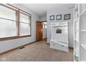 Bright mudroom featuring a bench with hooks, a window, and a neutral color scheme at 1146 Mount Vernon Dr, Greenwood, IN 46142