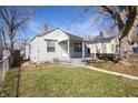 A cozy home with a neat front lawn and mature trees, perfect for a starter home at 1622 N Linwood Ave, Indianapolis, IN 46218