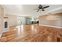 Spacious living room featuring hardwood floors, stainless steel refrigerator and fireplace at 1721 Rachel Dr, Plainfield, IN 46168
