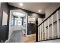 Bright entryway featuring an archway, a staircase with white railings, and views to front door at 19252 Chestnut Grove Ln, Noblesville, IN 46062