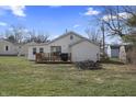 Image of the back of a single-story home with a quaint wooden deck and slider access at 3018 Alice Ave, Indianapolis, IN 46237