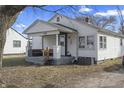Cozy single-Gathering home featuring a covered front porch with outdoor seating and a tidy, traditional design at 3039 Alice Ave, Indianapolis, IN 46237
