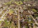 Aerial view of a residential neighborhood with tree-lined streets and diverse housing styles at 3104 Alice Ave, Indianapolis, IN 46237
