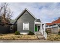 Charming gray home with a cozy front porch and neat landscaping at 3732 N Kenwood Ave, Indianapolis, IN 46208