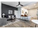 Cozy living room with modern decor, wood floors, and an open floor plan at 3732 N Kenwood Ave, Indianapolis, IN 46208