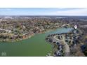 Expansive aerial shot of lakeside houses with boat docks and a tranquil lake setting at 5901 Crystal Bay West Dr, Plainfield, IN 46168