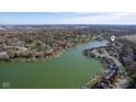 Scenic aerial view of waterfront homes, boat docks, and lush greenery by the lake at 5901 Crystal Bay West Dr, Plainfield, IN 46168