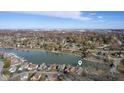 Picturesque aerial scene of waterfront homes surrounded by colorful trees and serene lake at 5901 Crystal Bay West Dr, Plainfield, IN 46168