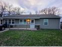 Charming single-story home featuring a welcoming front porch and vinyl siding for easy maintenance at 610 Rose Ln, Mooresville, IN 46158