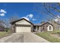Lovely home featuring an attached two-car garage and a long concrete driveway at 7152 Sandalwood Dr, Avon, IN 46123