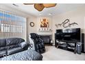 Cozy living area with modern entertainment setup, including a large screen TV and fireplace at 7236 Wyatt Ln, Indianapolis, IN 46217